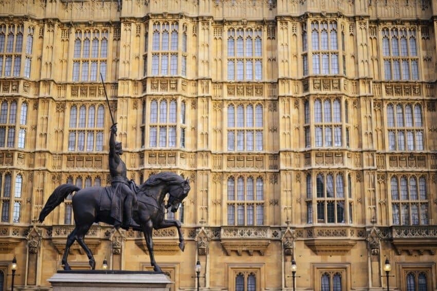 Photographed alongside the Houses of Parliament.