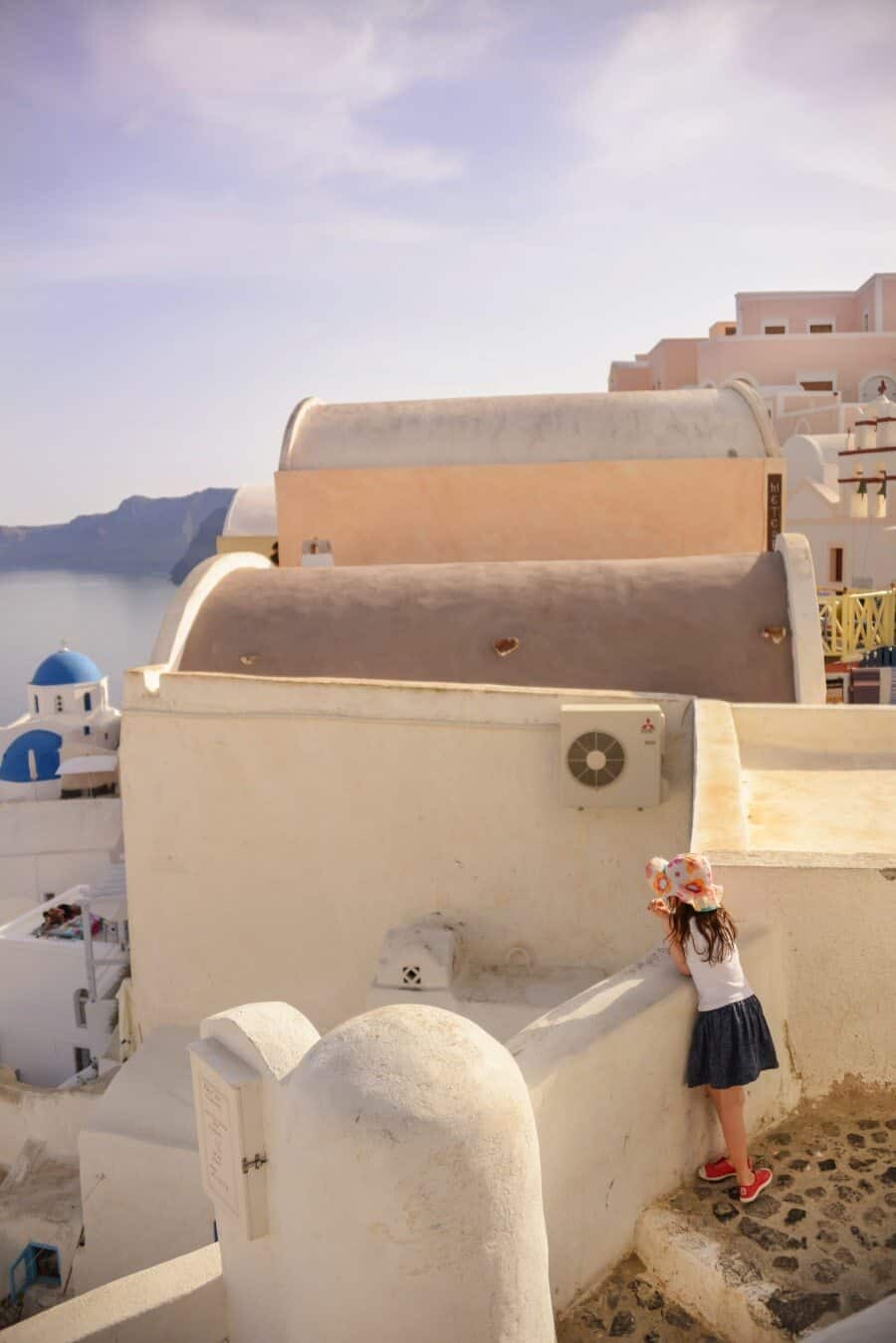 Opposite Vallas Cafe - Fira to Imerovigli Walk Just opposite this little cafe you'll find an old wooden boat perched on top of a white washed roof. It's also where there's a seahorse ornament with the caldera backdrop, a perfect spot to take some iconic shots!