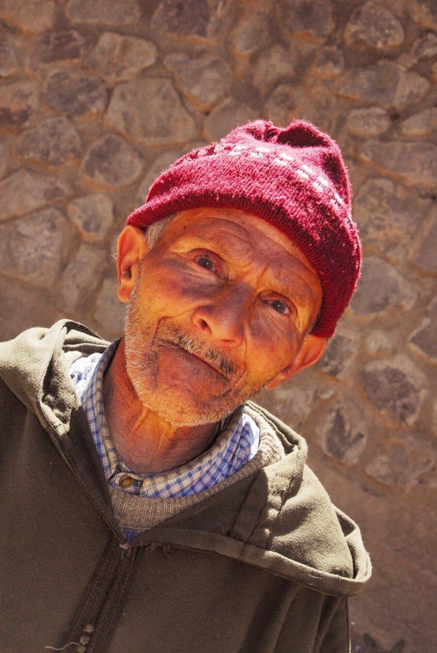 Imlil, Morocco: We were hiking in the Atlas Mountains when I stayed back to take some photos of the landscape. I soon noticed a lonely figure approaching from a path higher up and as he slowly walked towards me he stopped to stare and I showed him the photo I had taken. He put his hand out then stood and I assumed he wanted his portrait taken...I gave him an Australian dollar which he studied and then showed him his portrait which put a little smile on his face. Then he continued his walk down the mountain and I took a deep breath thankful for such an interaction.