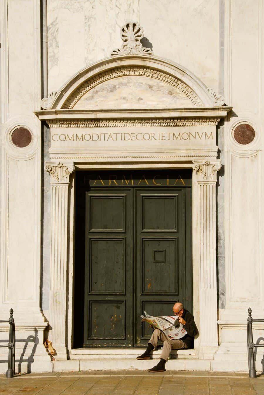 Venice, Italy: An example of capturing a local going about their day and blending it with a sense of place. Reading his paper on the steps of this cathedral, the composition of the scene was already done for me.
