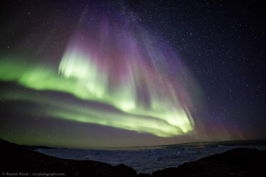 Northern lights and icebergs at the Unesco Ilulissat Icefjord in Greenland