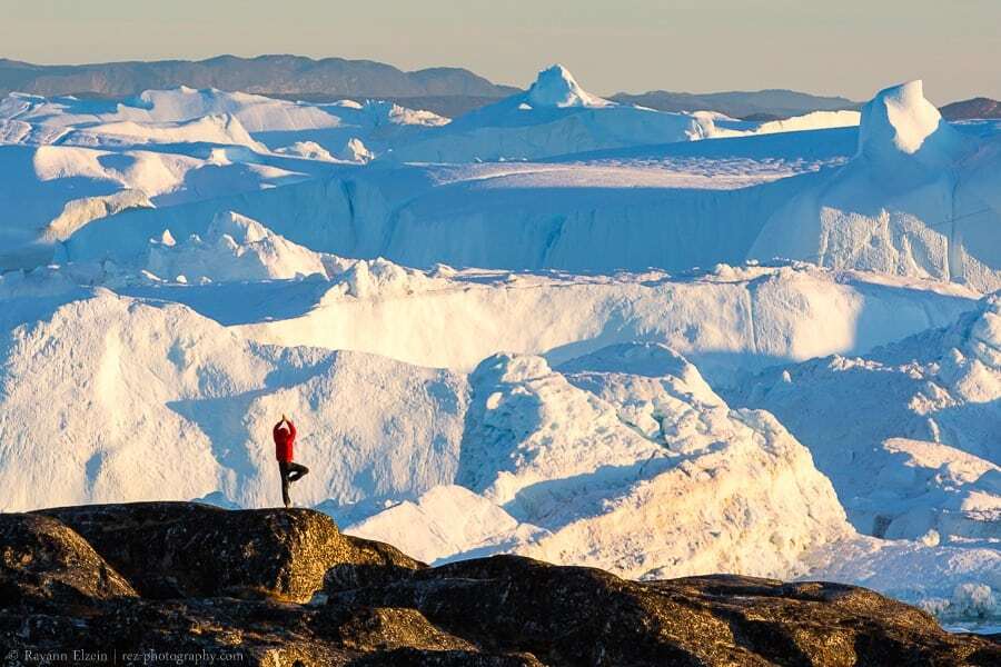 Yoga in front of the icebergs of the Unesco Ilulissat Icefjord