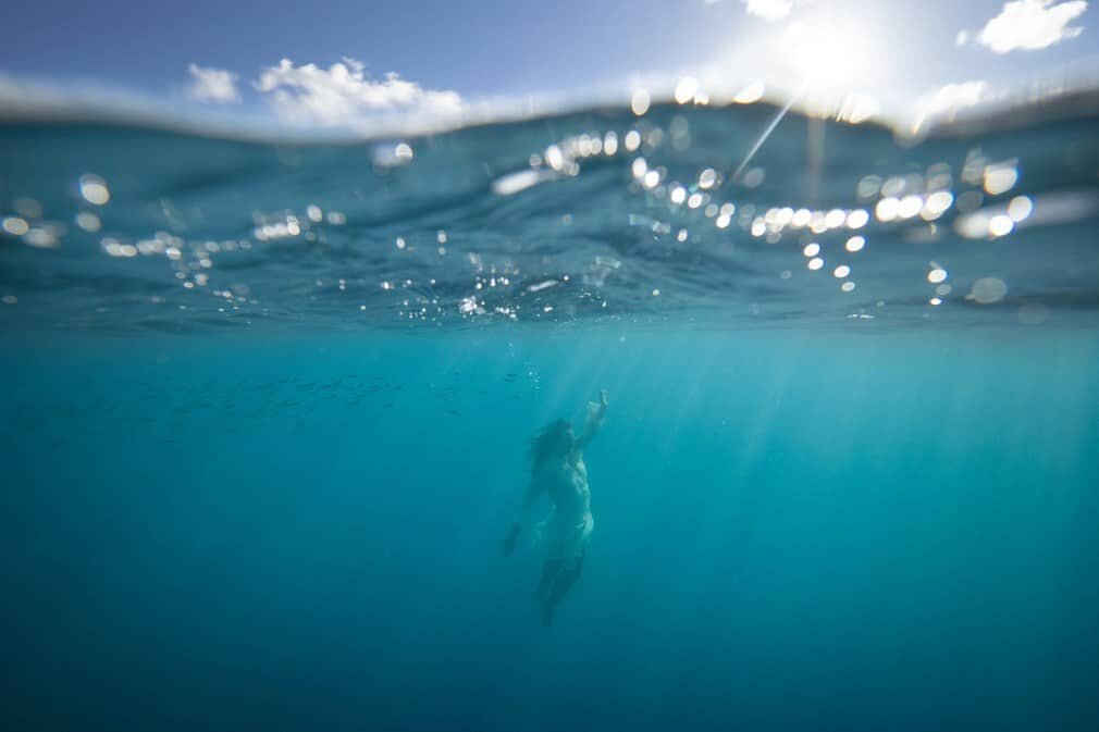 Underwater Photography Great Barrier Reef, model in white dress dancing underwater, photography by Lisa Michele Burns