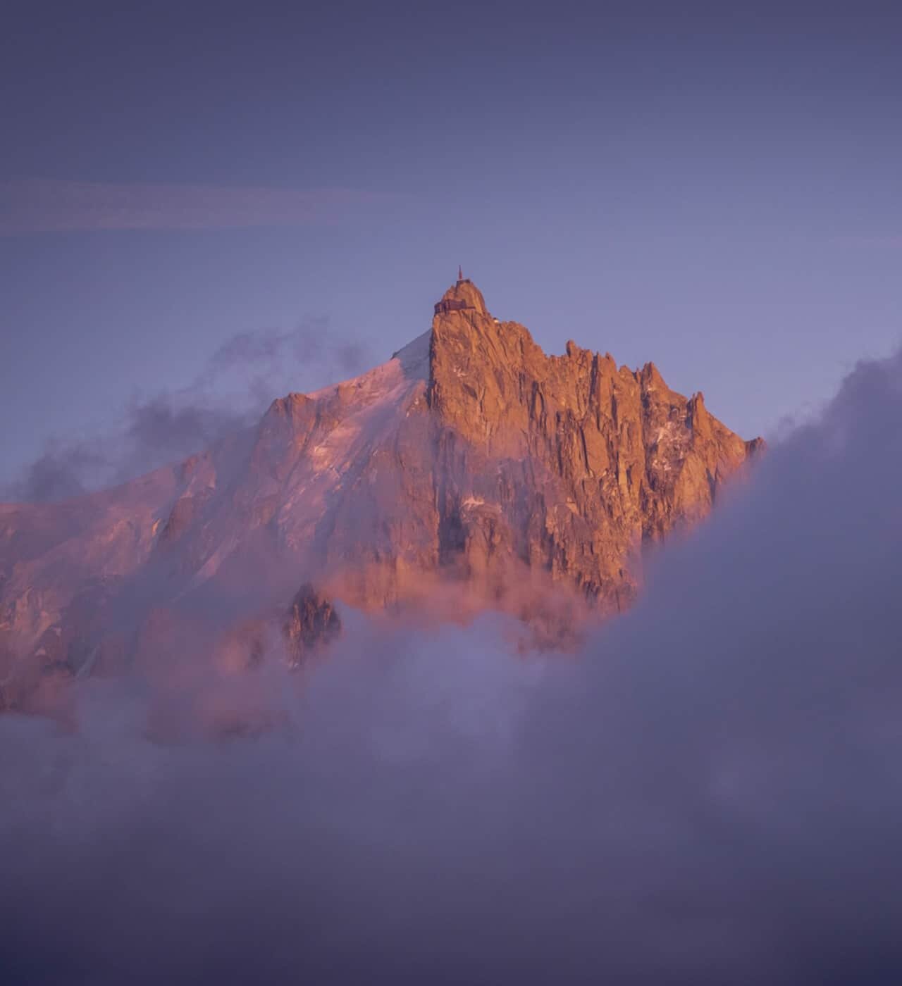 Bjørne models laser-cut Ljós lampshades on mountain sunsets